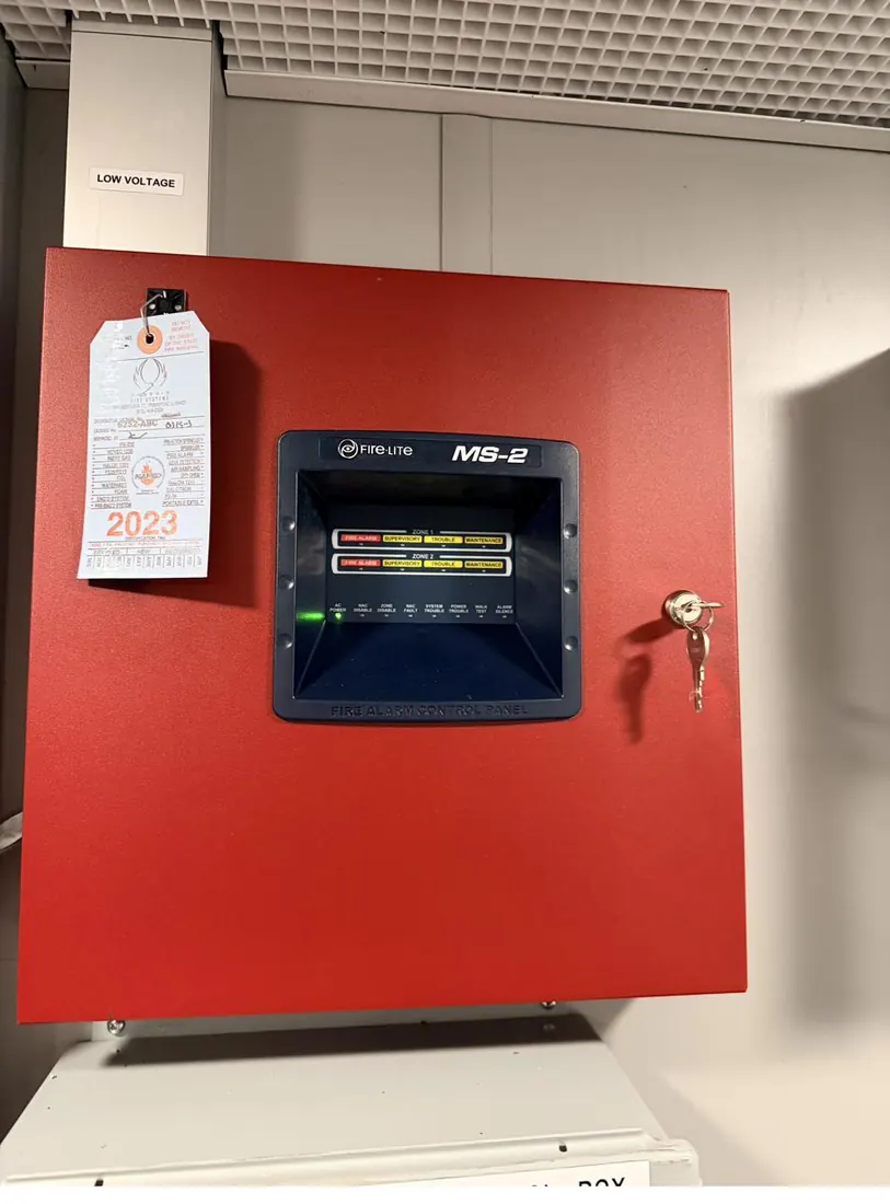 Fire alarm control panel mounted and tagged inside a mobile medical trailer